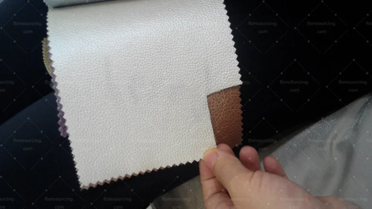 Upholstery fabric sample inspection during Dubai apartment sourcing — FBM Sourcing