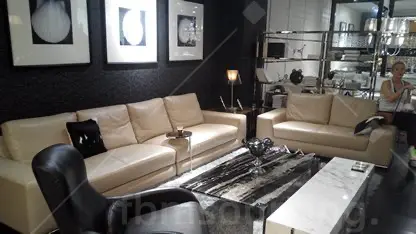 Cream leather sofa set at Guangzhou furniture showroom during Dubai apartment sourcing trip — FBM Sourcing