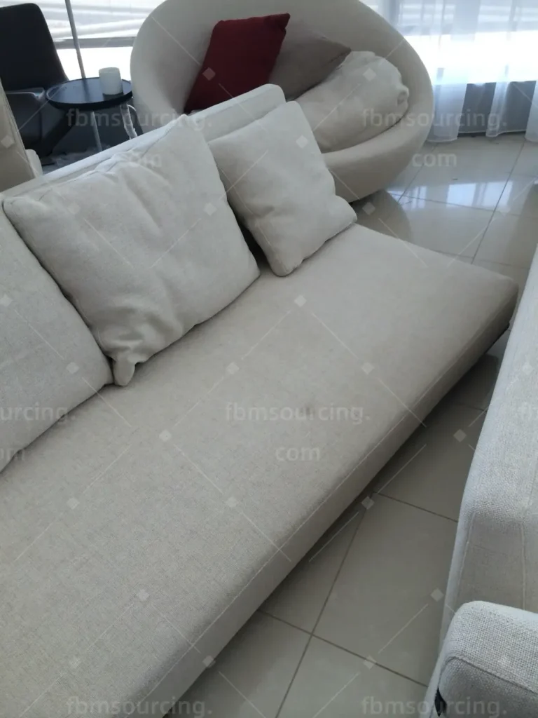 Cream fabric sofa and round accent chair quality check before container loading to Dubai — FBM Sourcing