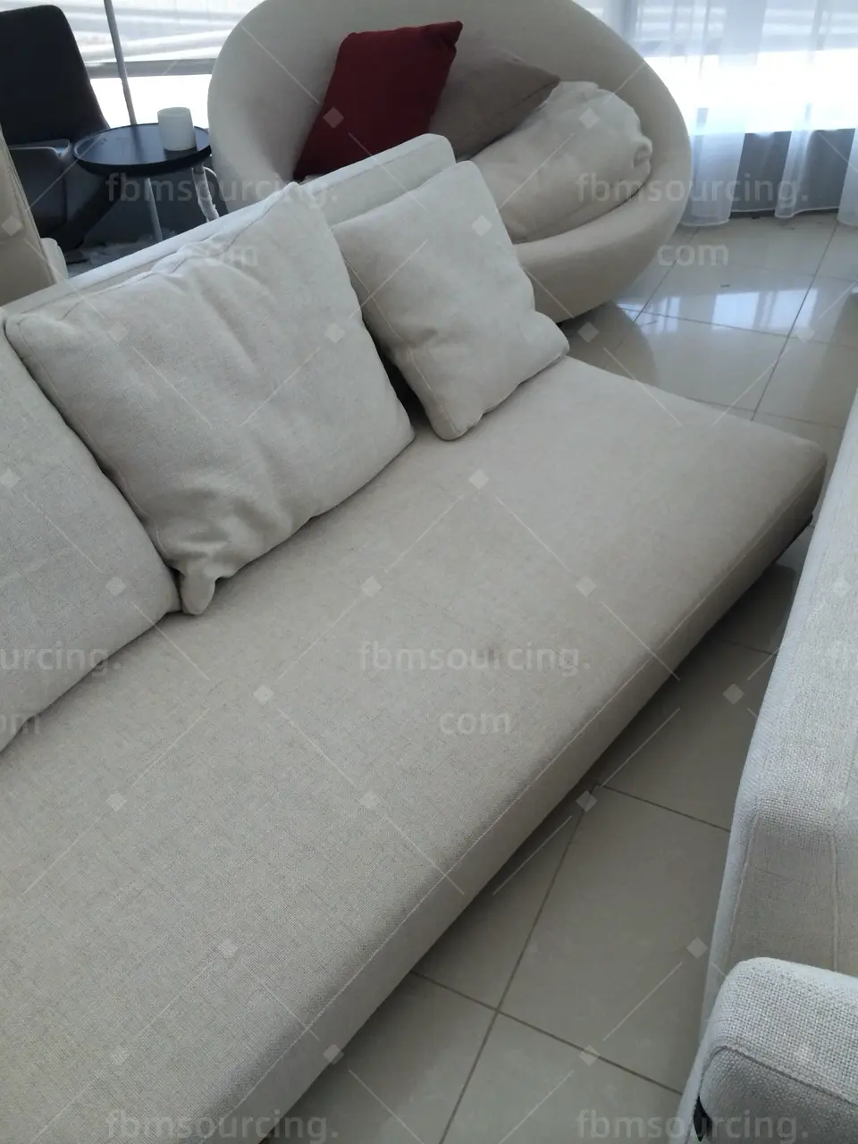 Cream fabric sofa and round accent chair quality check before container loading to Dubai — FBM Sourcing