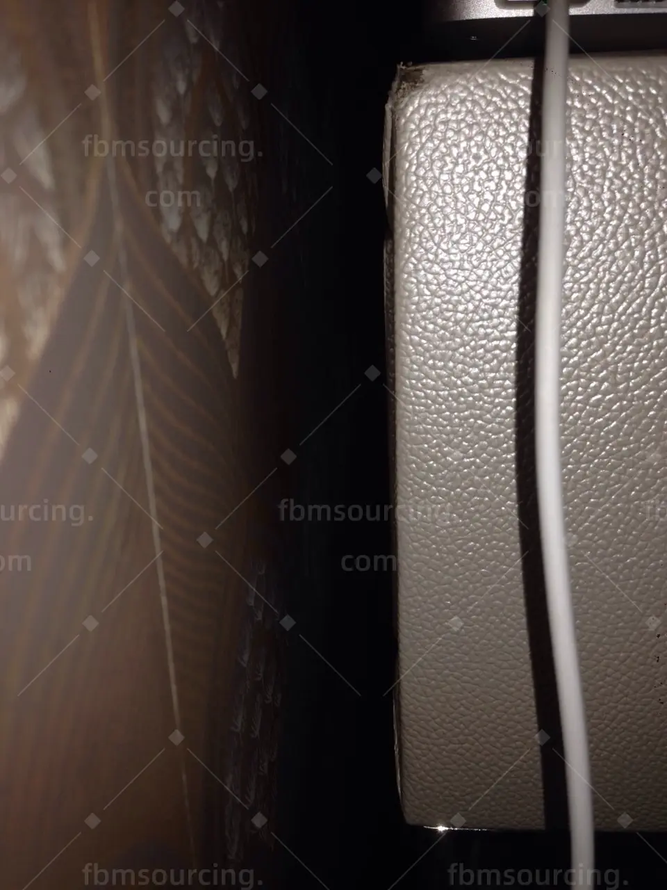 Brown leather texture close-up during quality inspection — FBM Sourcing Dubai