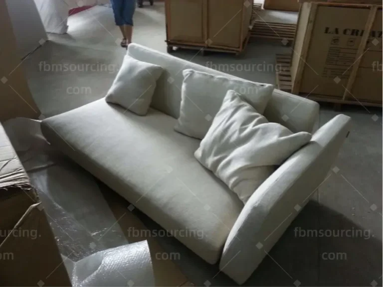 Cream sofa wrapped and ready for container loading to Dubai — FBM Sourcing