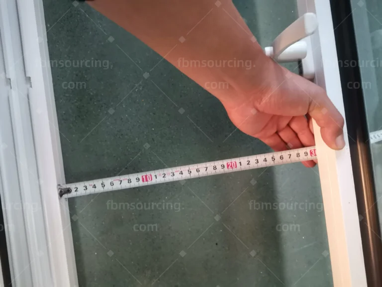 Aluminum window sash width measured during QC at China factory — Florida elementary school project