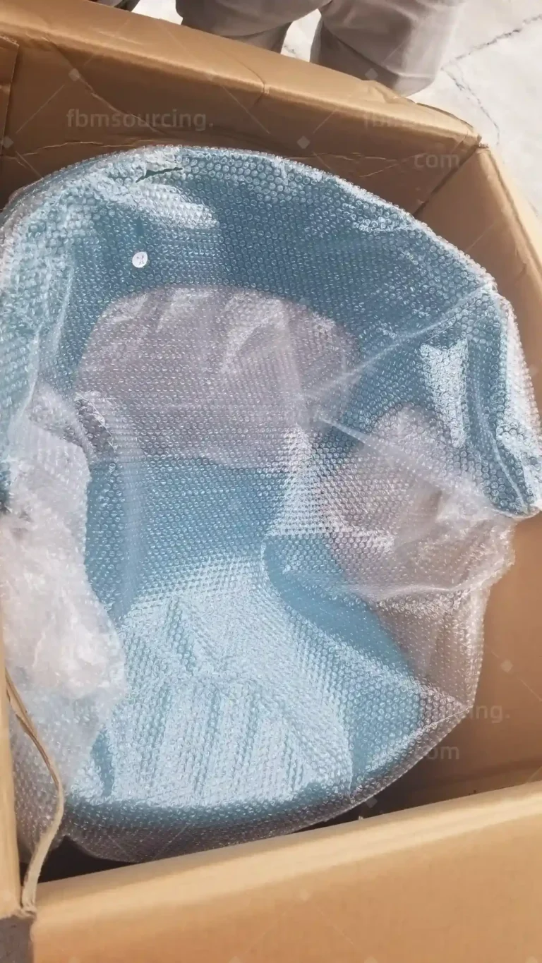 Fragile homeware bubble-wrapped and boxed before container loading