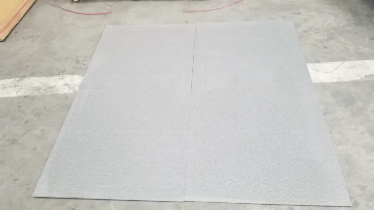 Grey full-body porcelain paver tiles inspected for Australia home