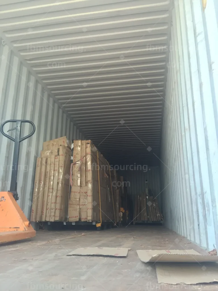 Container part-loaded with packed building materials for the villa project