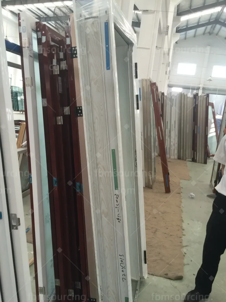 Timber interior door leaves checked at the door factory during the villa sourcing trip