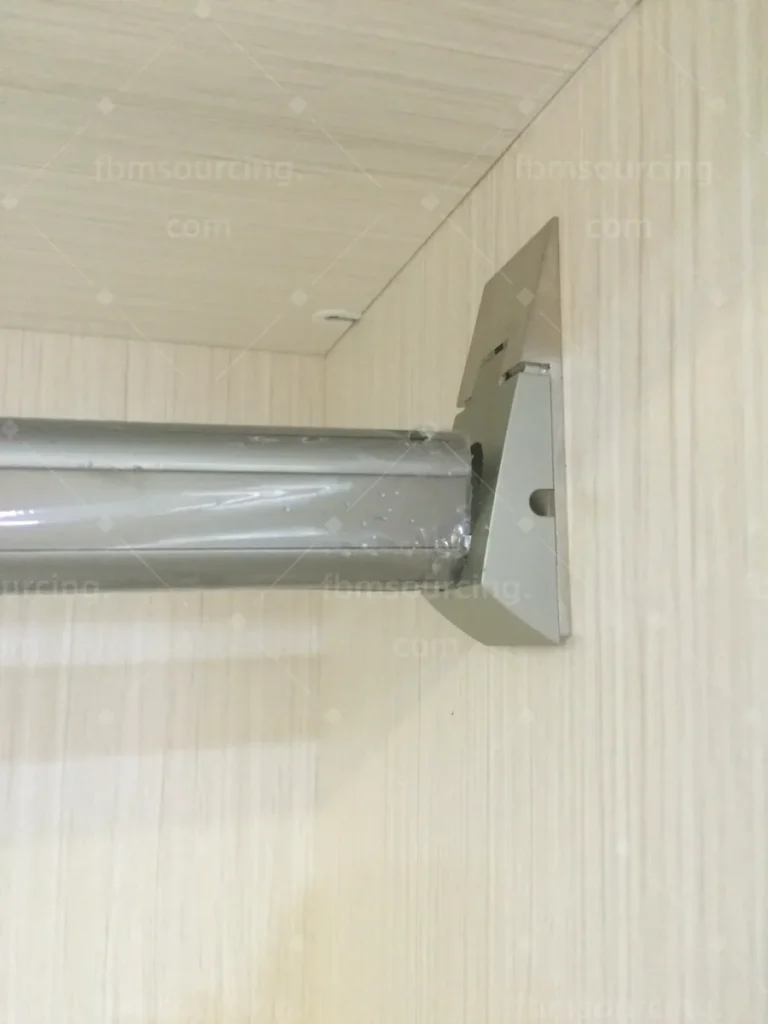 Wardrobe hanging rail and fitting quality checked during cabinet sourcing in China