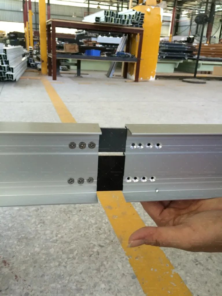 Machined connection holes on a window frame member verified before assembly