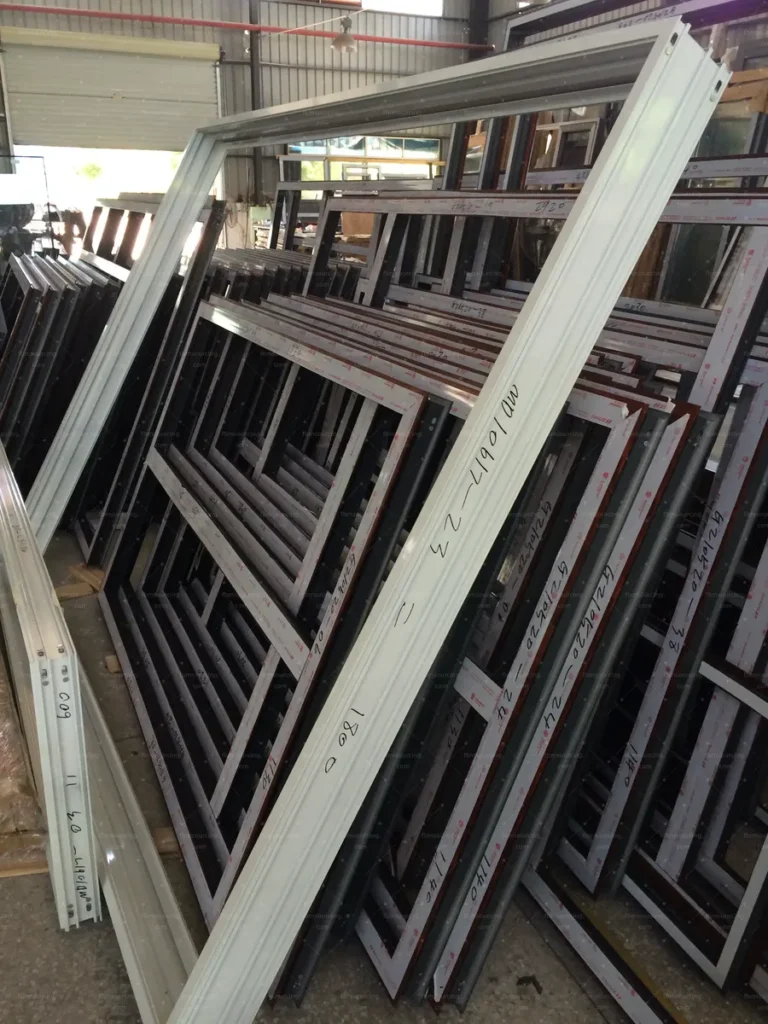 Completed window frames staged in the workshop during our QC visit