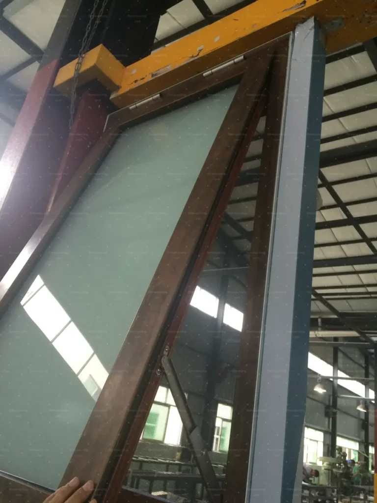 Awning window sash checked on the assembly bench for the villa order