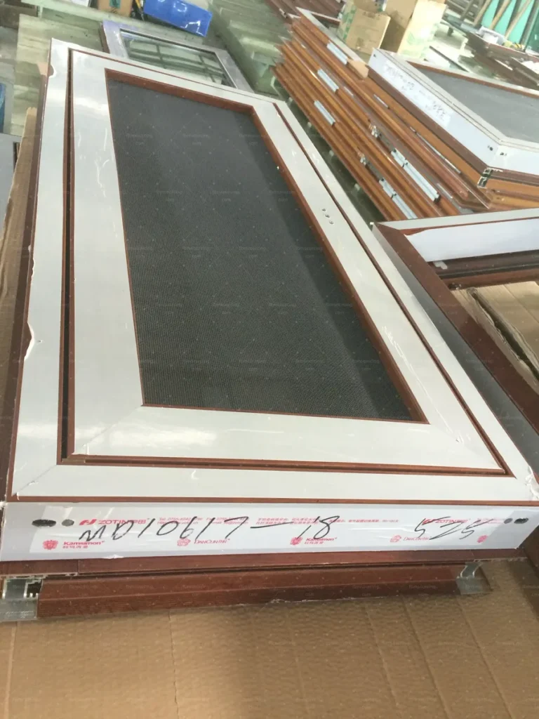 Stainless mesh screen panel inspected and labelled with its window number