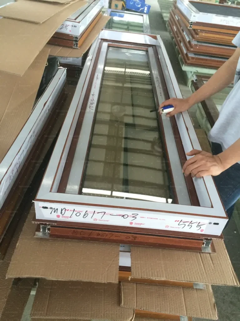Timber-look sliding door panel inspected and marked with its item number