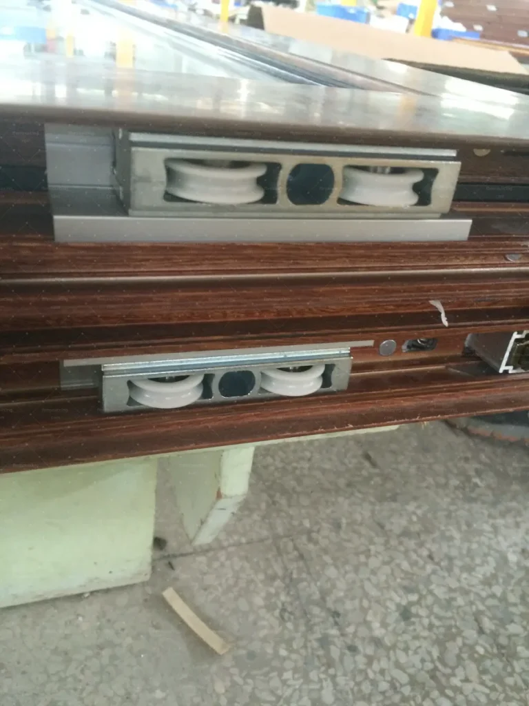 Sliding door roller and track detail checked for smooth operation