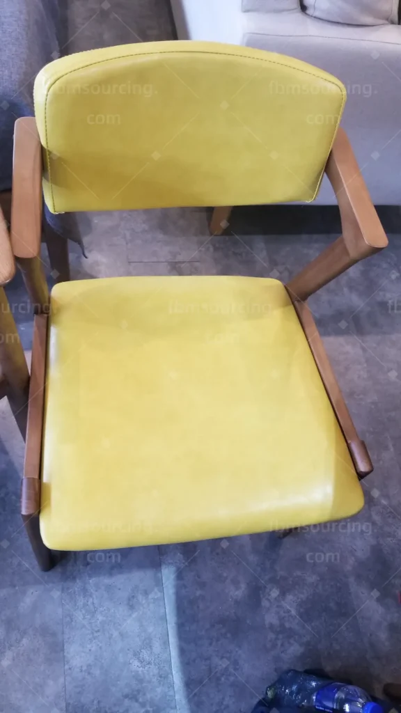 Mustard leather dining chair sample shortlisted at furniture market