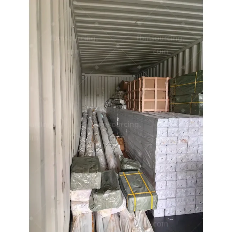 Light poles and packed cartons arranged in mixed container load for park project