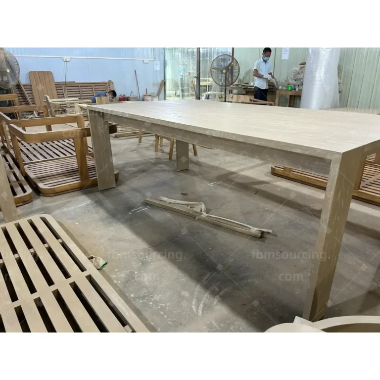Long teak outdoor dining table inspected at China furniture factory for park project