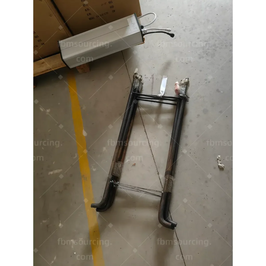 Street light pole components laid out for completeness check during QC
