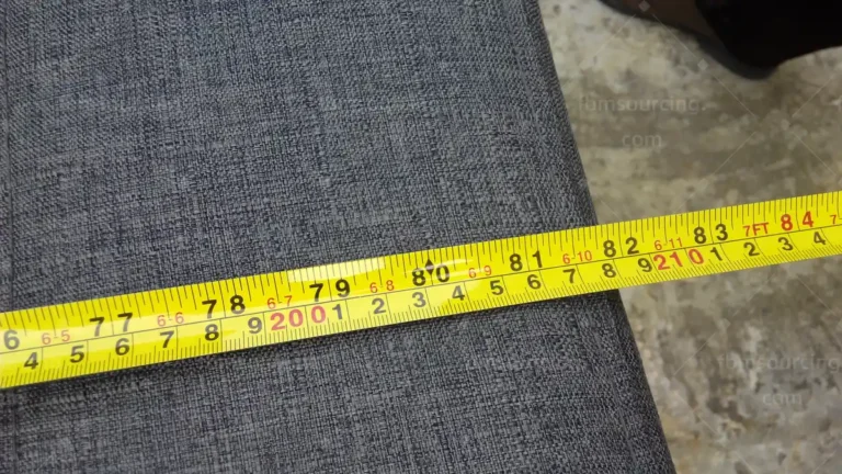 Netherlands sofa and office chair procurement - sofa fabric panel width measurement with tape during QC