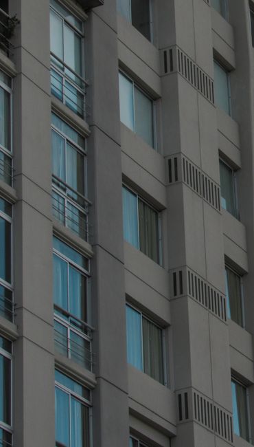 Close-up of a modern building facade with windows in Salta, Argentina.