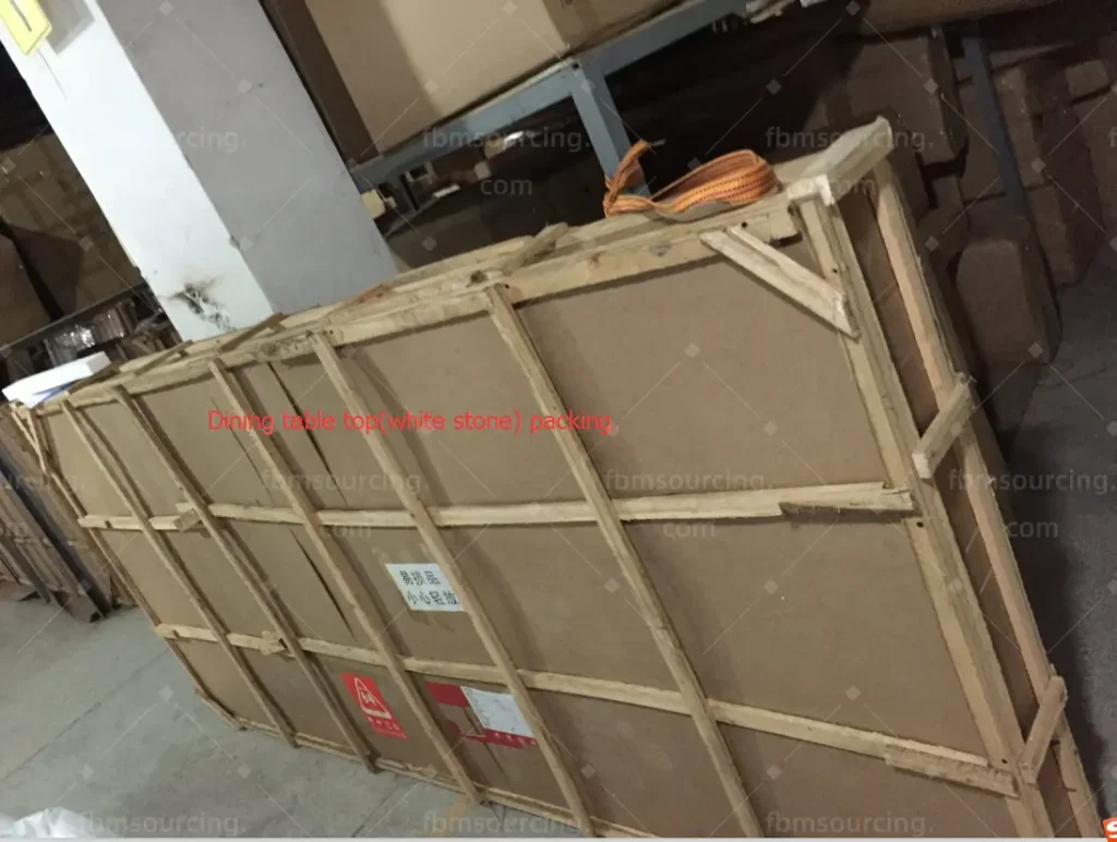 Dining table stone top wrapped and crated for quality inspection