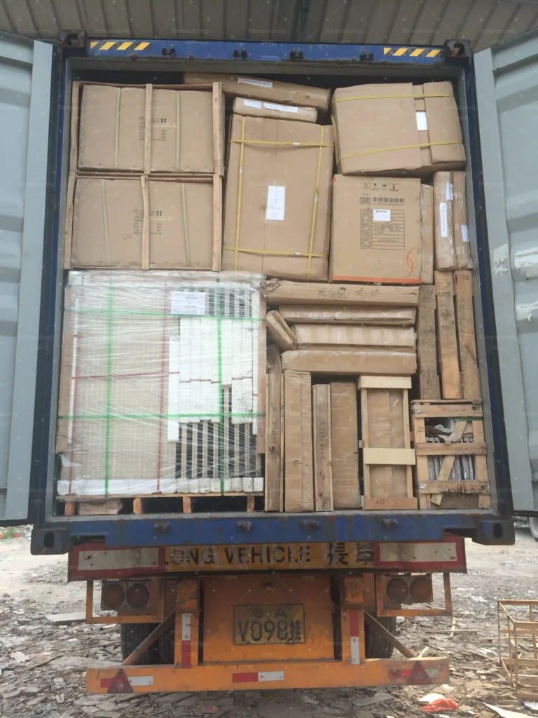 Container fully loaded with crated furniture and building materials