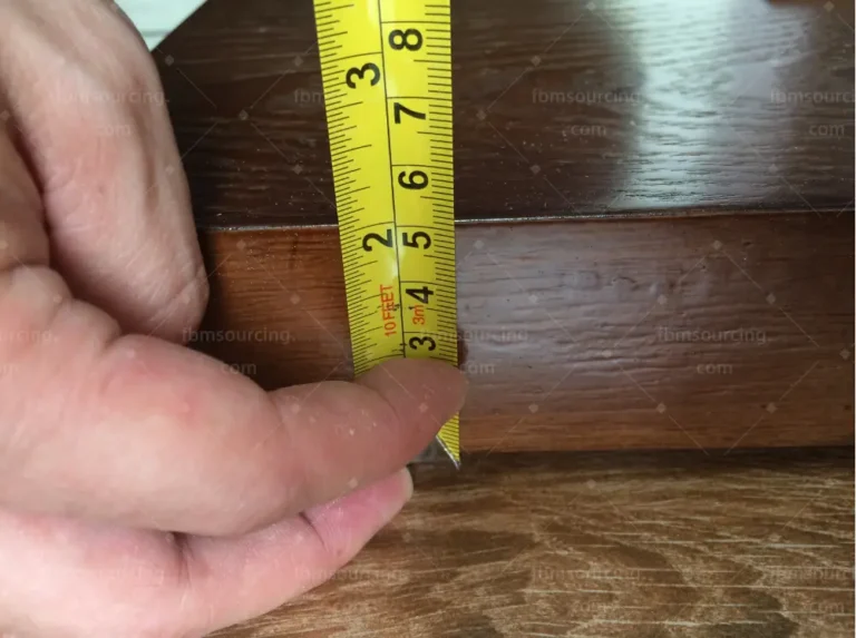 Tape measure verification of solid wood flooring planks during pre-shipment inspection