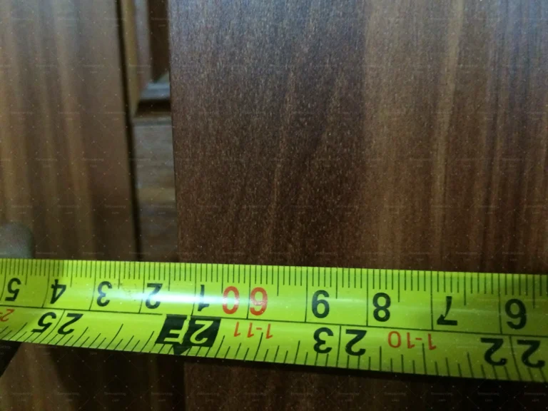Dimension check on hardwood panels at a China furniture factory for the Saudi villa order