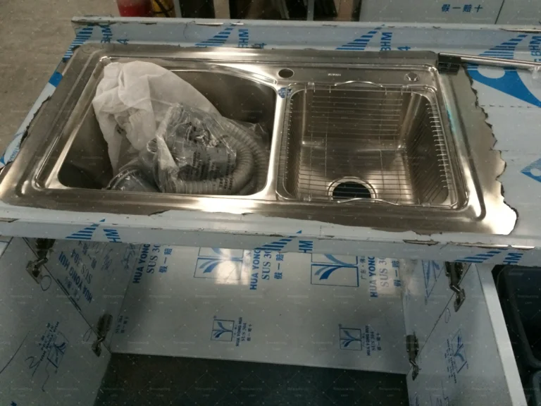 Stainless steel kitchen sink unit inspected before packing for the villa kitchen fit-out