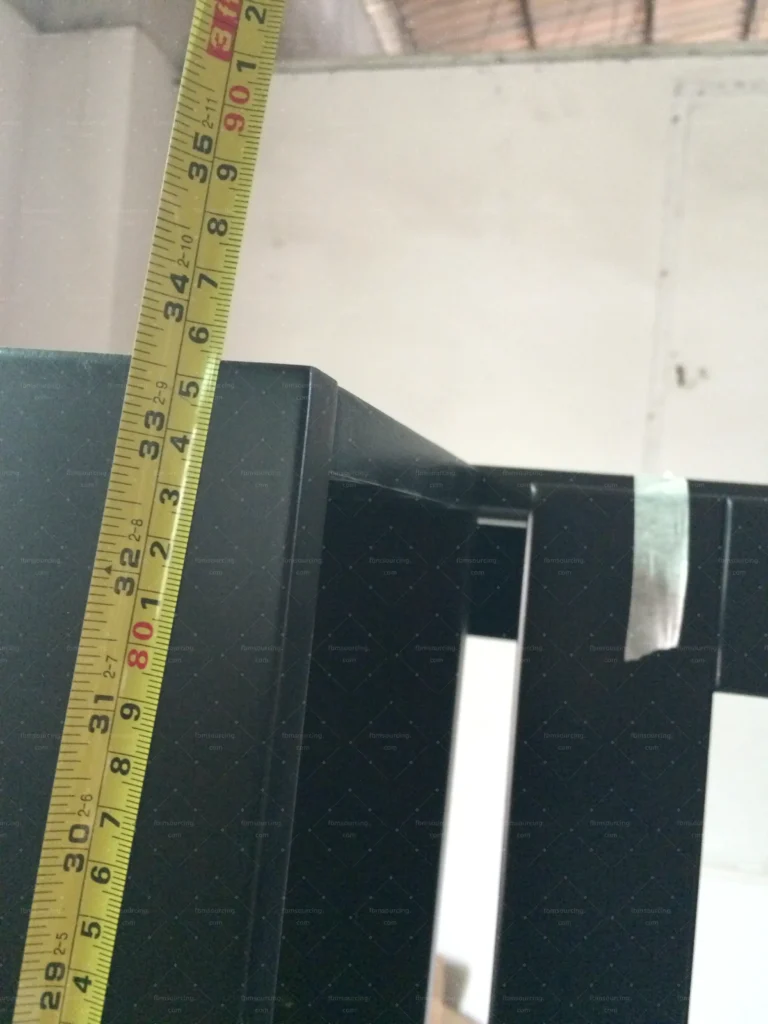 Wardrobe height verified with tape measure during villa furniture QC