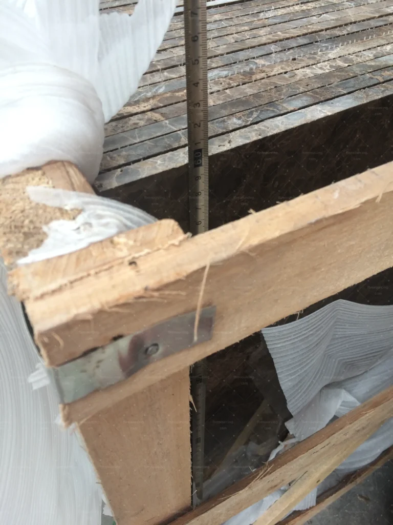 Timber components wrapped and checked before crating for export
