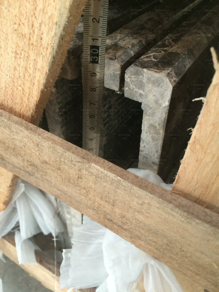Solid timber profiles inspected for finish quality before packing