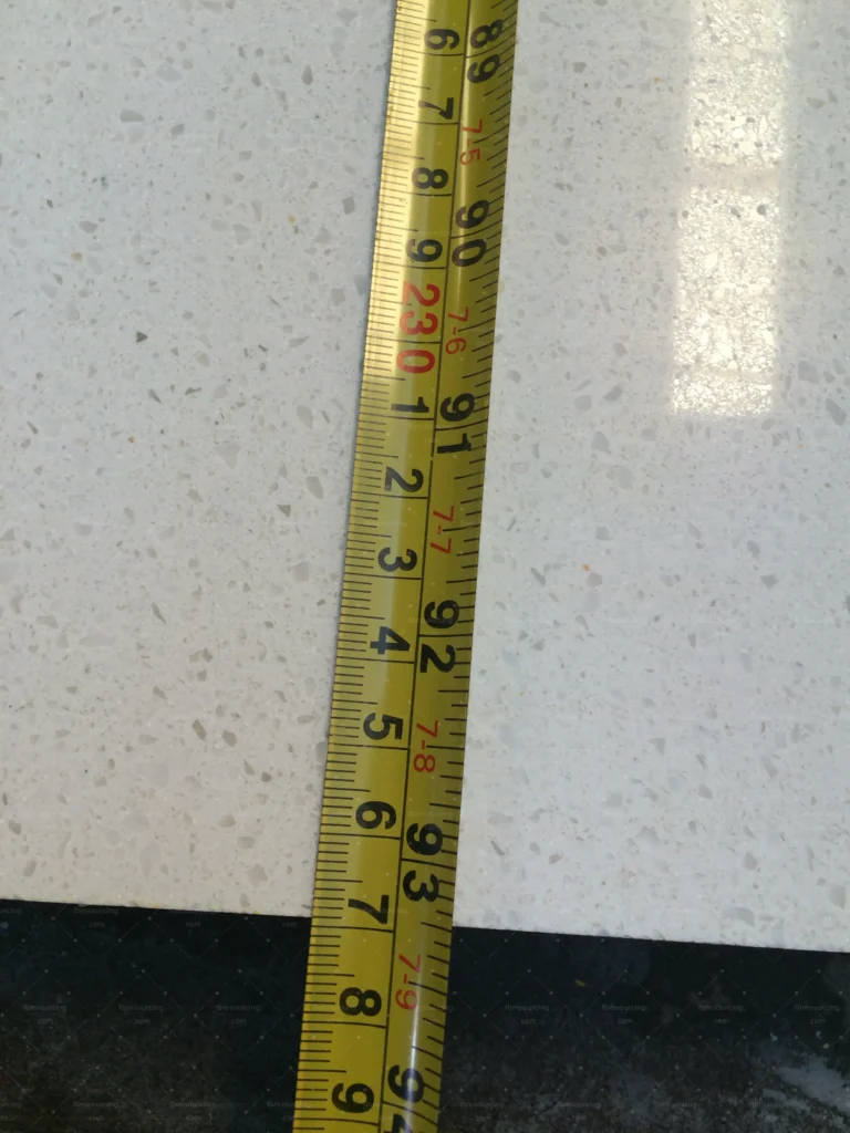 Quartz stone slab thickness measured during countertop quality control
