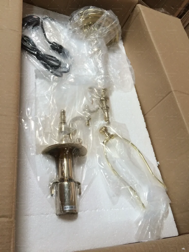 Chandelier components unboxed and verified during lighting quality control