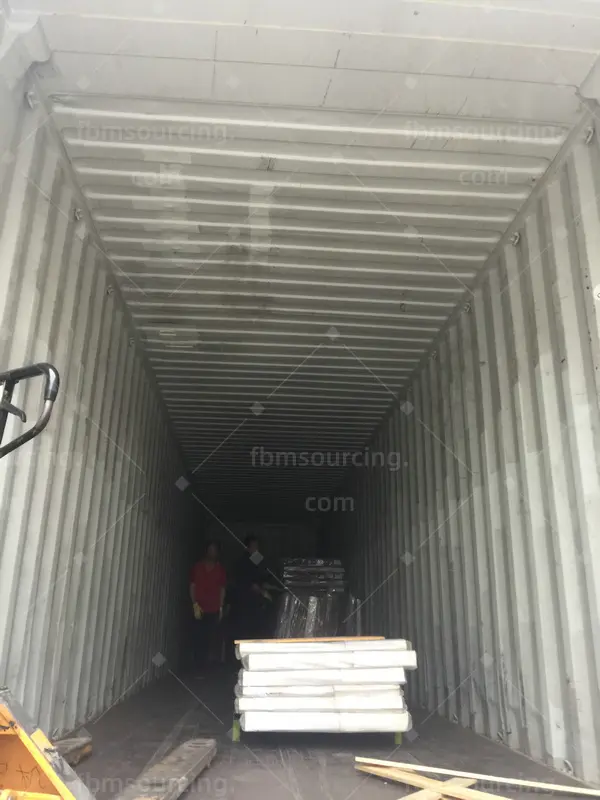 building material sourcing agent container loading - first pallets loaded for US shipment - US contractor project