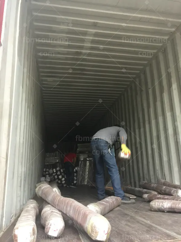 building material sourcing agent container loading - wrapped aluminum profiles loaded into container - US contractor project