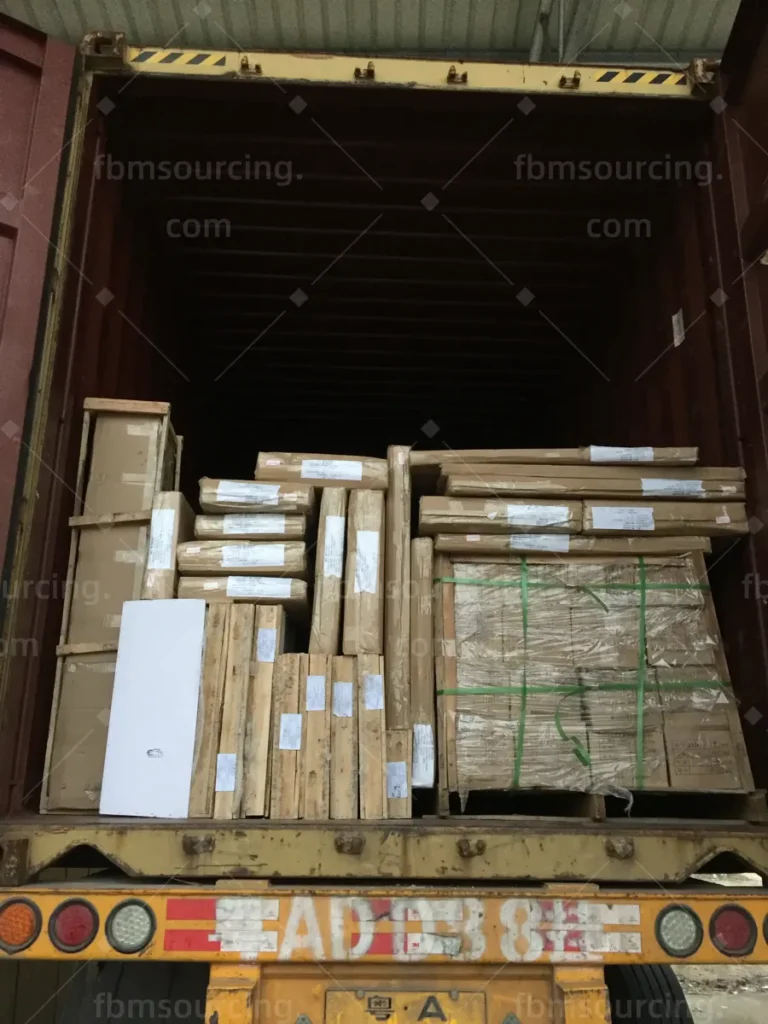 Container fully loaded with crated furniture and building materials