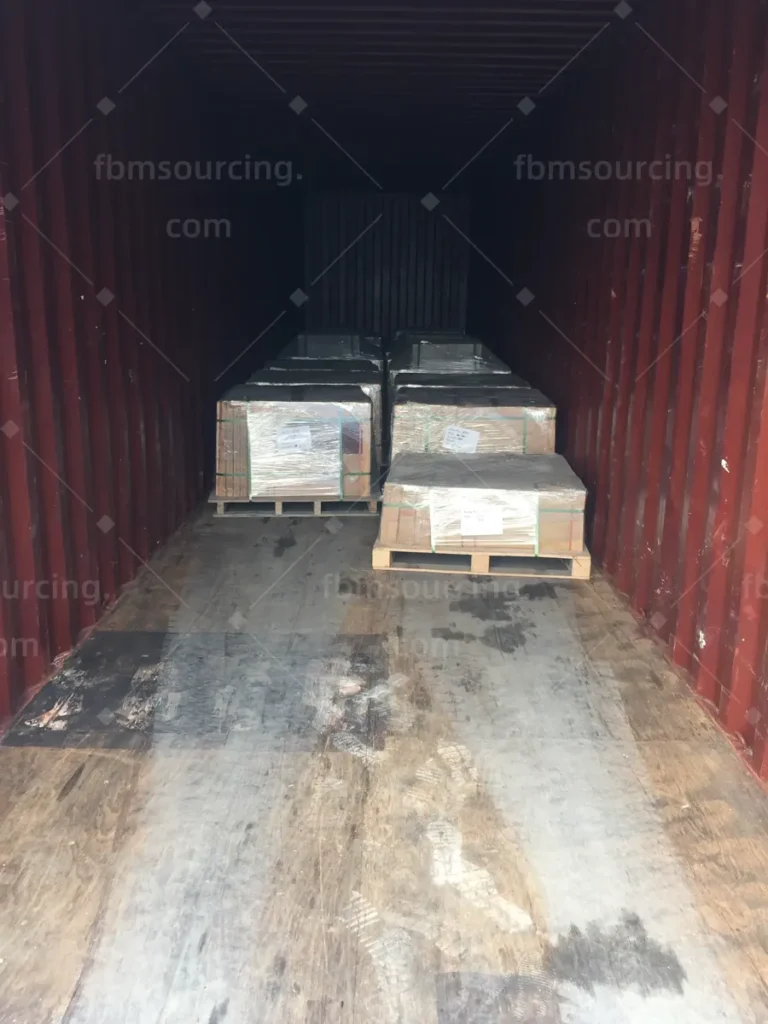 Container loading in progress with palletised building materials