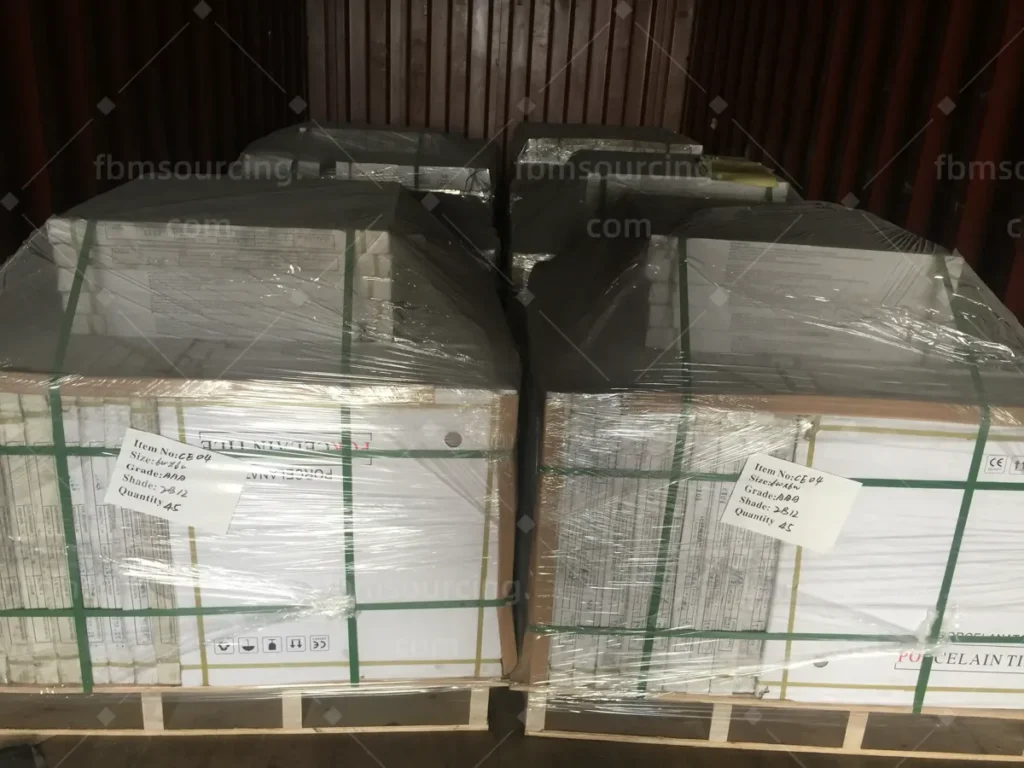 Porcelain tile pallets secured inside container before door closing