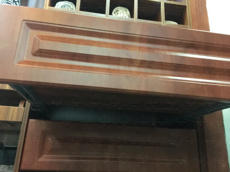 Timber cabinet door finish and colour checked by building material sourcing agent