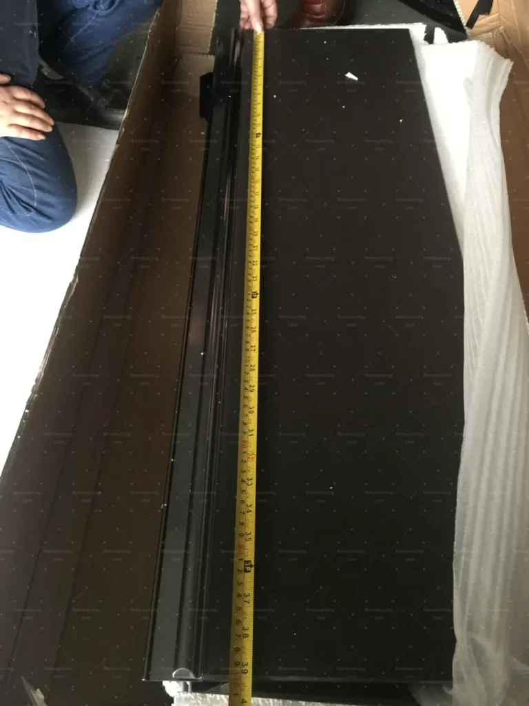 Kitchen cabinet door height measured with tape during QC inspection