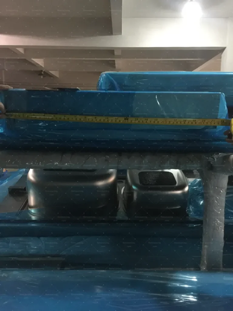 Stacked stainless sinks measured during factory quality inspection in China