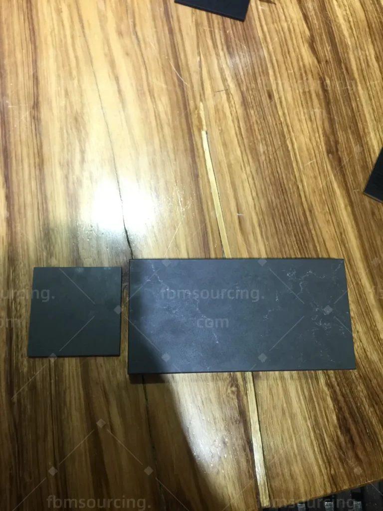 Stone and laminate samples compared during building materials selection in Foshan