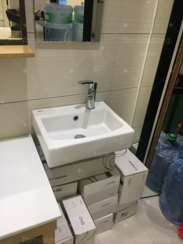 Wall-hung ceramic basin selection in Foshan sanitary ware showroom for villa bathrooms