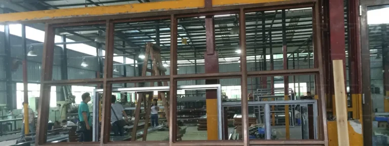 Custom timber-look aluminium windows and doors fabricated in China for an Australian villa project