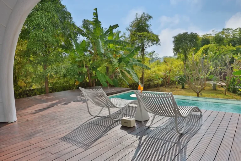 Resort pool deck with outdoor lounge furniture for commercial hospitality projects