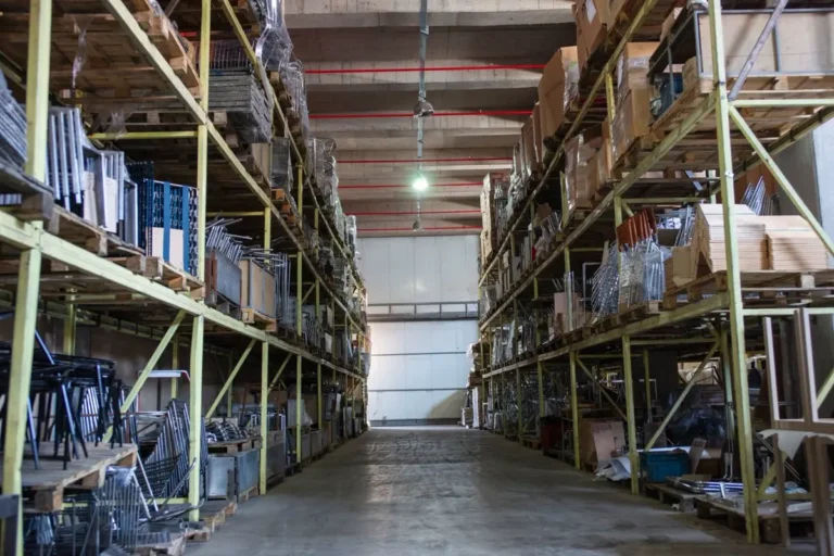 Factory warehouse racking holding project furniture stock for staggered delivery from China