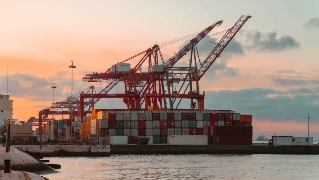 Container cranes and stacked containers at a port ahead of the Chinese New Year shipping rush