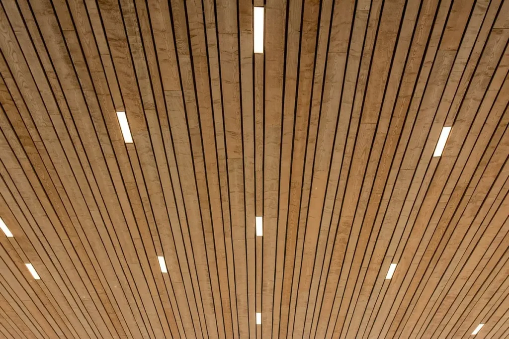 Wood slat wall and ceiling panels in a commercial interior - Class A flame spread wall panels from China for US projects