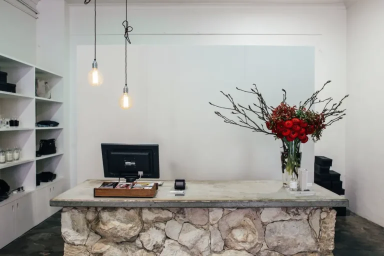 Stone-clad checkout millwork counter in a retail store fit-out